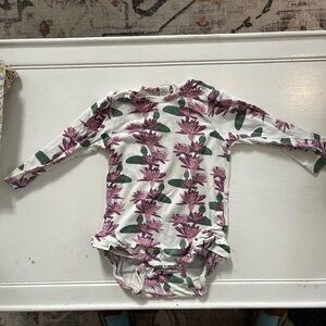 Kate Quinn onesie w ruffles at leg